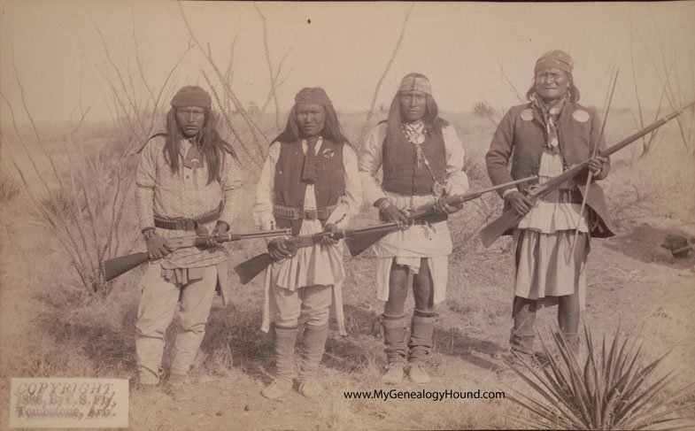 1886 historic photo of Geronimo with his son and two Apache scouts.
