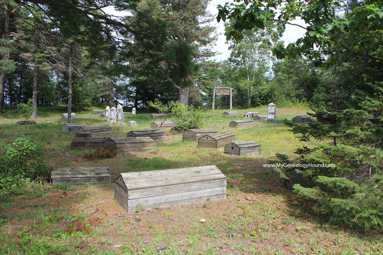 Spirit Houses on the graves within the Old Indian Burial Ground, Bay Mills, Michigan cemetery, view toward back of cemetery.