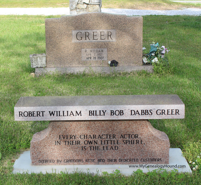 A memorial bench in honor of Robert William "Dabbs Greer" at the foot of his grave.