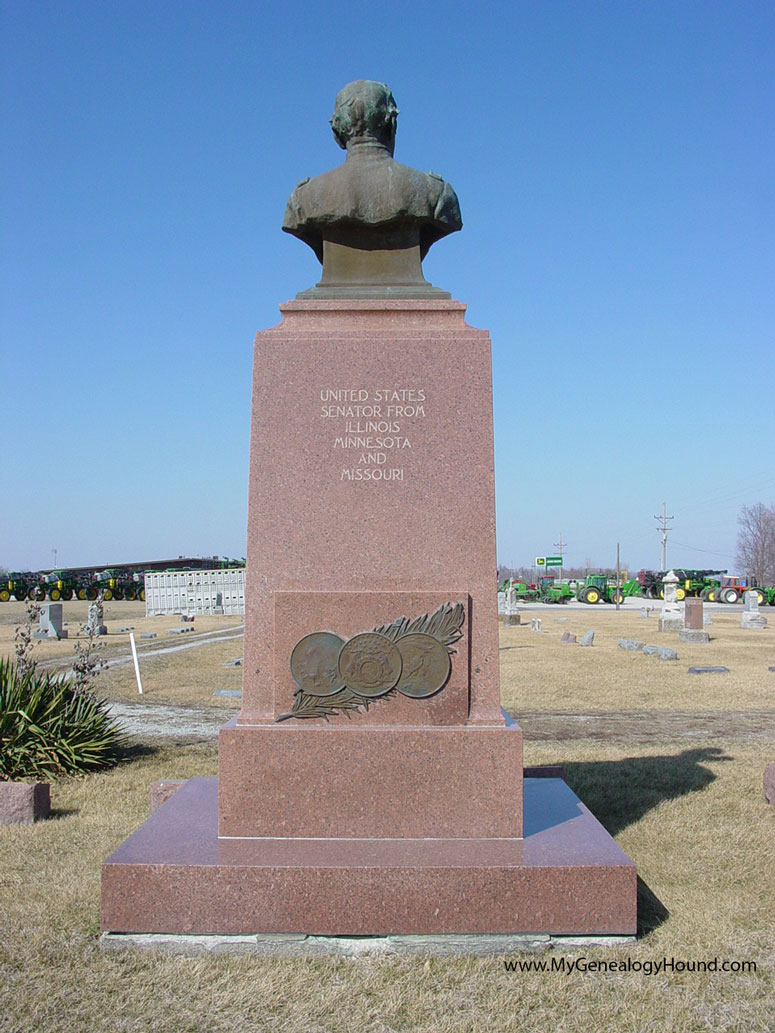 A monument to James Shields, erected by an Act of Congress in 1910, marking his grave in the St. Mary's Cemetery, Carrollton, Missouri. Backside, with three state seals.
