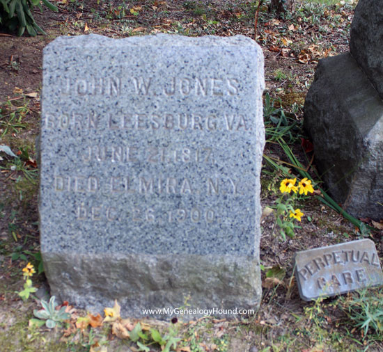 The original small tombstone of John W. Jones in Woodlawn Cemetery, Elmira, New York.